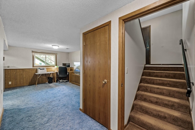 4133 88th Ave NE, Blaine, MN 55014 - carpeted office with a textured ceiling, wainscoting, and wooden walls