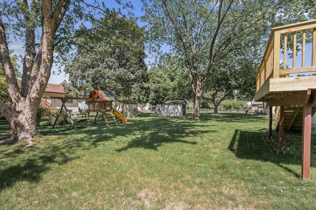 4133 88th Ave NE, Blaine, MN 55014 - view of yard featuring a playground, a storage shed, stairs, and a deck