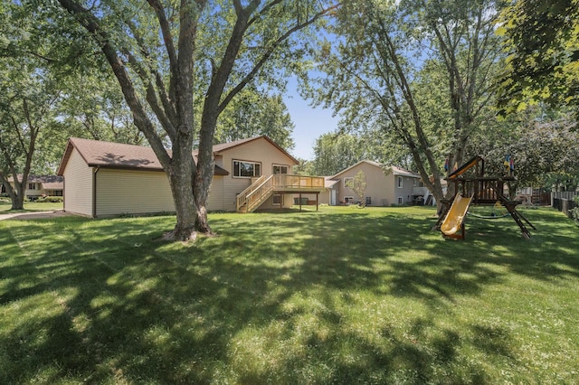 4133 88th Ave NE, Blaine, MN 55014 - view of green lawn featuring a playground, stairway, and a deck