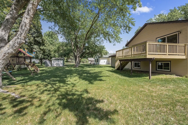 4133 88th Ave NE, Blaine, MN 55014 - view of green lawn featuring a shed, stairs, a playground, and a wooden deck