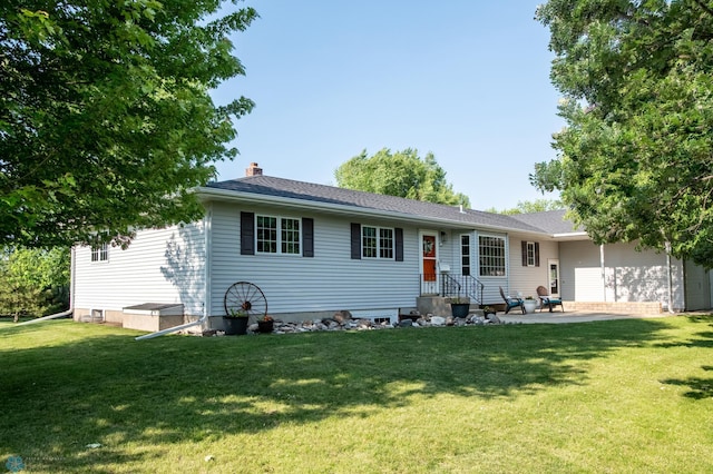 15544 60th Ave S, Riverton Twp, MN 56547 - back of house featuring a yard, a patio, and a chimney