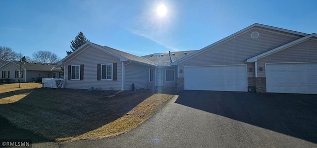13046 Brookside Ln N, Rogers, MN 55374 - ranch-style house featuring asphalt driveway and a garage