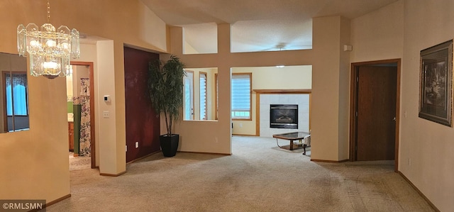 13046 Brookside Ln N, Rogers, MN 55374 - hallway featuring carpet floors, a chandelier, and a towering ceiling