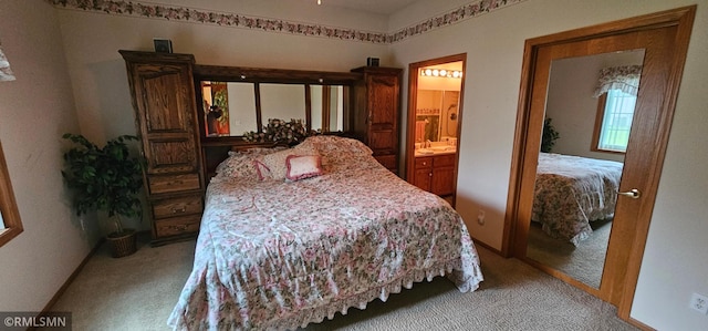 13046 Brookside Ln N, Rogers, MN 55374 - bedroom with light colored carpet and ensuite bathroom