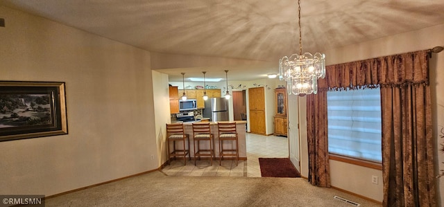 13046 Brookside Ln N, Rogers, MN 55374 - dining area with a chandelier and light colored carpet