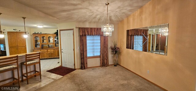 13046 Brookside Ln N, Rogers, MN 55374 - dining space with a chandelier and light tile patterned flooring