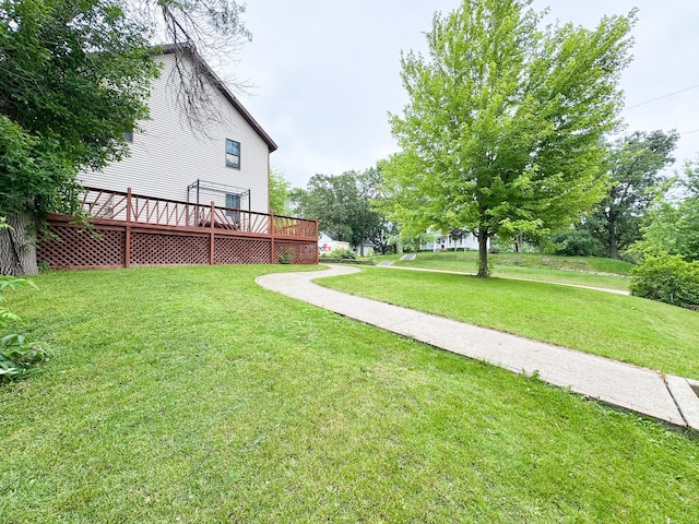301 4th Ave SE, Pelican Rapids, MN 56572 - view of grassy yard with a wooden deck