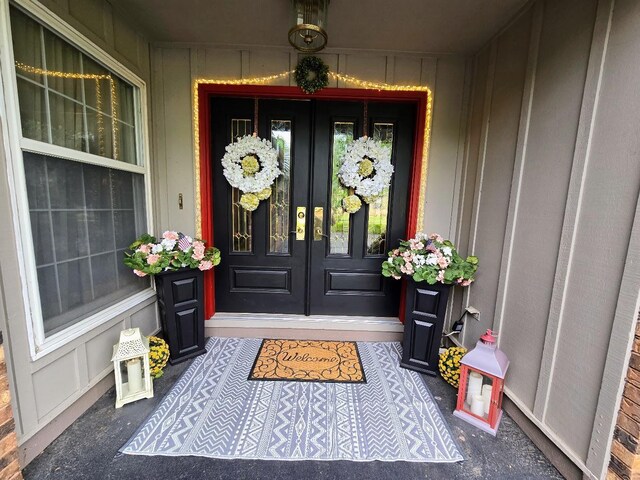 902 6th Ave SE, Pipestone, MN 56164 - entrance to property with french doors and board and batten siding