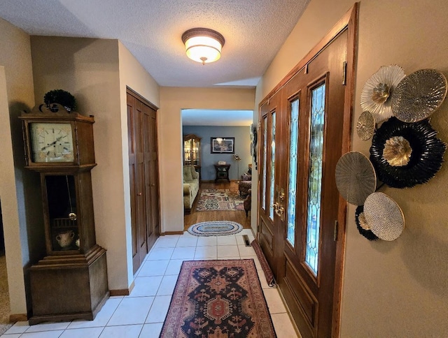 902 6th Ave SE, Pipestone, MN 56164 - corridor featuring light tile patterned floors and a textured ceiling