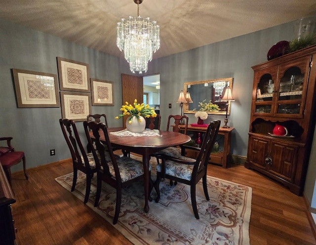 902 6th Ave SE, Pipestone, MN 56164 - dining room with wood finished floors and a chandelier
