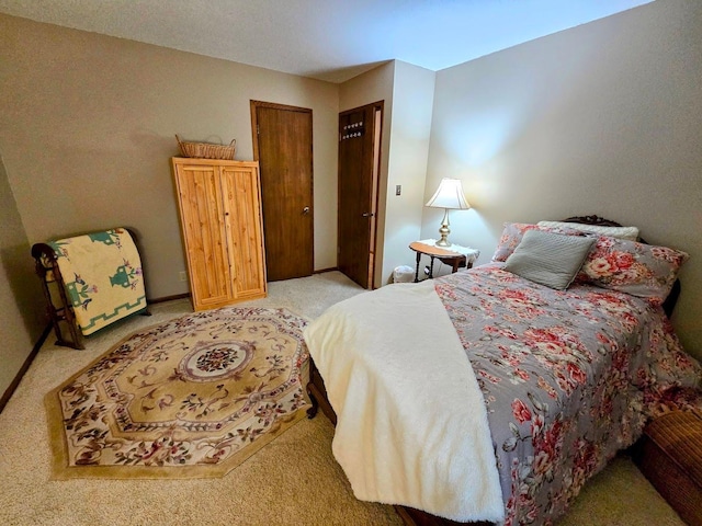 902 6th Ave SE, Pipestone, MN 56164 - bedroom with light colored carpet and baseboards