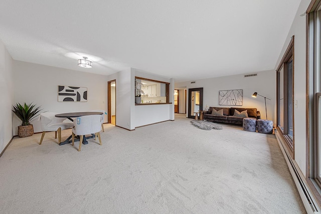 9700 Portland Ave S Unit 237, Bloomington, MN 55420 - living area with baseboard heating and light colored carpet