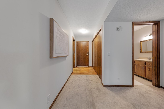 9700 Portland Ave S Unit 237, Bloomington, MN 55420 - hall featuring a textured ceiling and light carpet