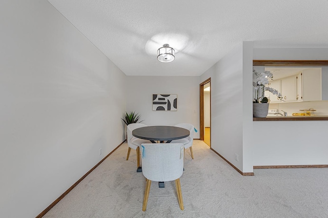 9700 Portland Ave S Unit 237, Bloomington, MN 55420 - dining area with light colored carpet and a textured ceiling