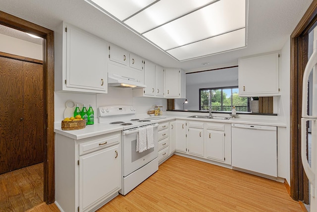 9700 Portland Ave S Unit 237, Bloomington, MN 55420 - kitchen featuring white appliances, exhaust hood, light wood finished floors, light countertops, and white cabinets