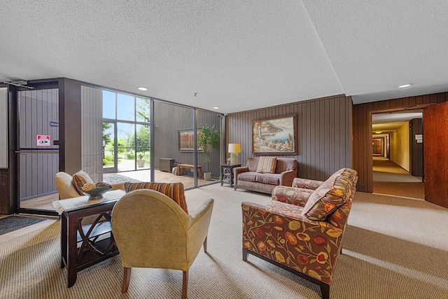 9700 Portland Ave S Unit 237, Bloomington, MN 55420 - living area featuring carpet flooring, a textured ceiling, recessed lighting, and wood walls