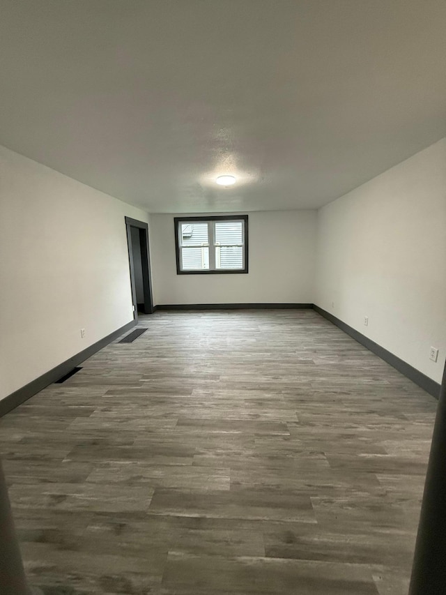 409 4th St W, Canby, MN 56220 - unfurnished room with baseboards and wood finished floors