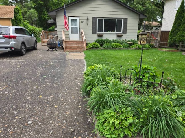 687 Dover St NE, Fridley, MN 55432 - bungalow-style home featuring asphalt driveway