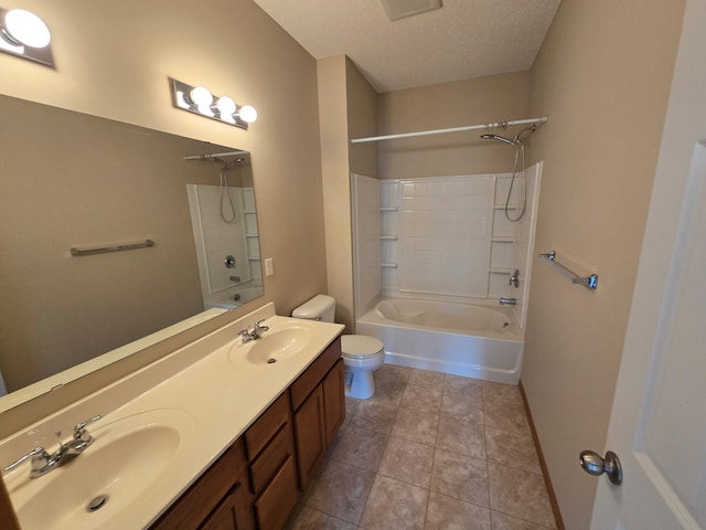 703 10th St S, Buffalo, MN 55313 - bathroom featuring shower / bathtub combination, double vanity, a textured ceiling, and tile patterned flooring