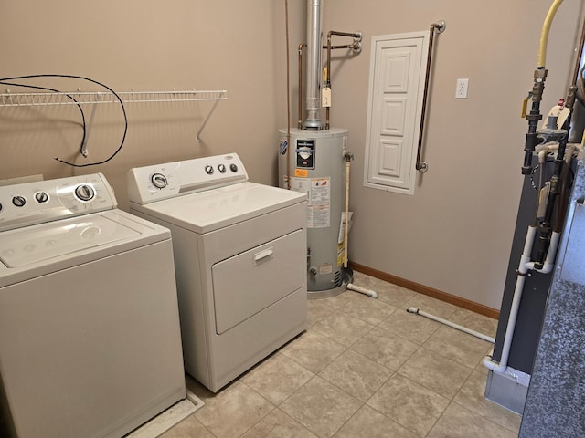 703 10th St S, Buffalo, MN 55313 - washroom with washer and clothes dryer, water heater, and light tile patterned floors