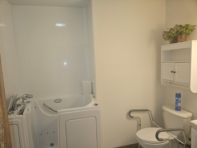 442 Cleveland Ave W, Winnebago, MN 56098 - bathroom with a jetted tub and toilet