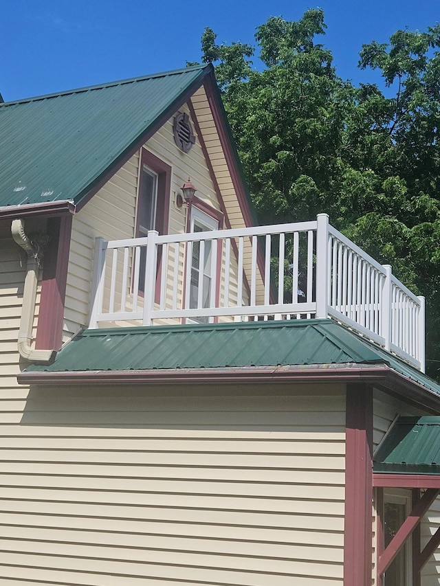442 Cleveland Ave W, Winnebago, MN 56098 - view of side of property featuring a metal roof and a balcony