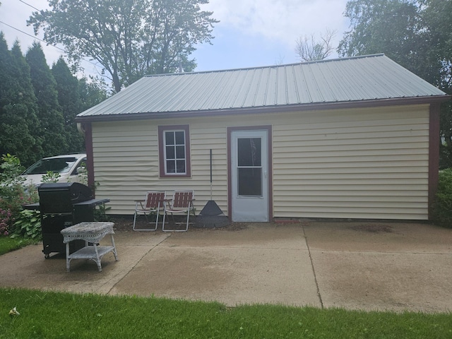 442 Cleveland Ave W, Winnebago, MN 56098 - back of property with a patio and a metal roof