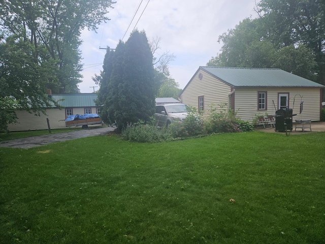 442 Cleveland Ave W, Winnebago, MN 56098 - view of grassy yard with a patio area