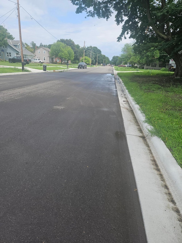 442 Cleveland Ave W, Winnebago, MN 56098 - view of asphalt road with curbs