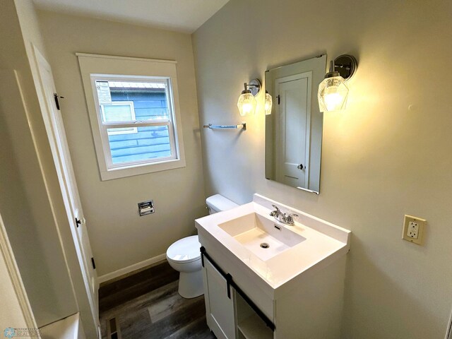 217 6th St SE, Barnesville, MN 56514 - half bathroom featuring vanity and wood finished floors