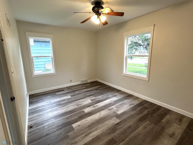 217 6th St SE, Barnesville, MN 56514 - spare room featuring dark wood-style floors and a ceiling fan