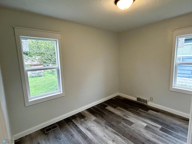 217 6th St SE, Barnesville, MN 56514 - spare room featuring dark wood-style floors
