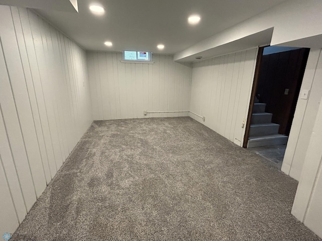 217 6th St SE, Barnesville, MN 56514 - basement with carpet floors, stairs, wood walls, and recessed lighting