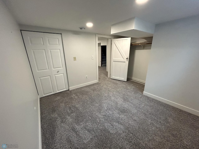 217 6th St SE, Barnesville, MN 56514 - unfurnished bedroom featuring dark carpet and recessed lighting
