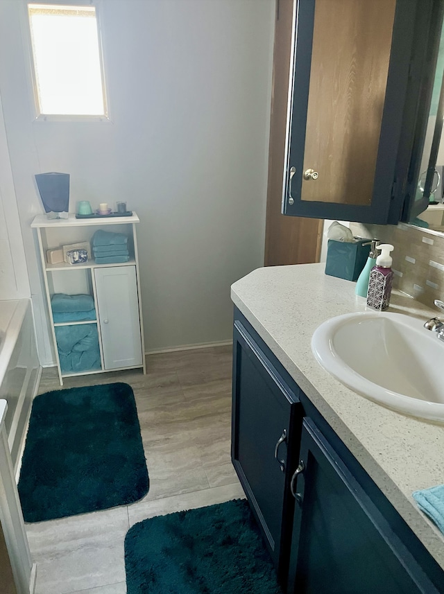 1323 Pine Tree Dr, Maplewood, MN 55119 - full bath with vanity, a bath, and wood finished floors