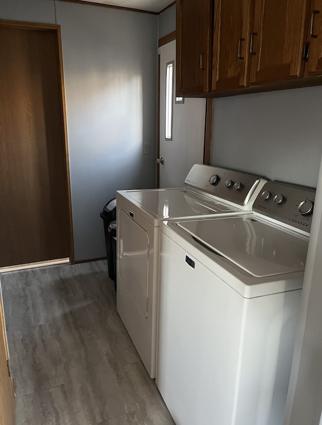 1323 Pine Tree Dr, Maplewood, MN 55119 - laundry room with cabinet space and separate washer and dryer