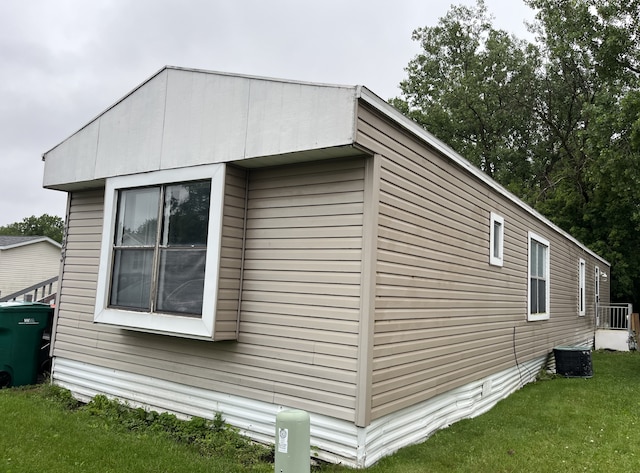 1323 Pine Tree Dr, Maplewood, MN 55119 - view of side of property with a yard