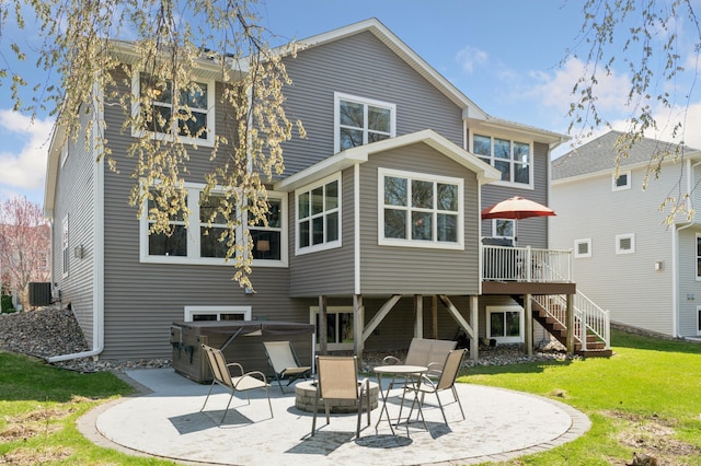 3608 Strawberry Ln, Chanhassen, MN 55331 - rear view of house featuring a hot tub, a patio area, stairway, a yard, and a wooden deck
