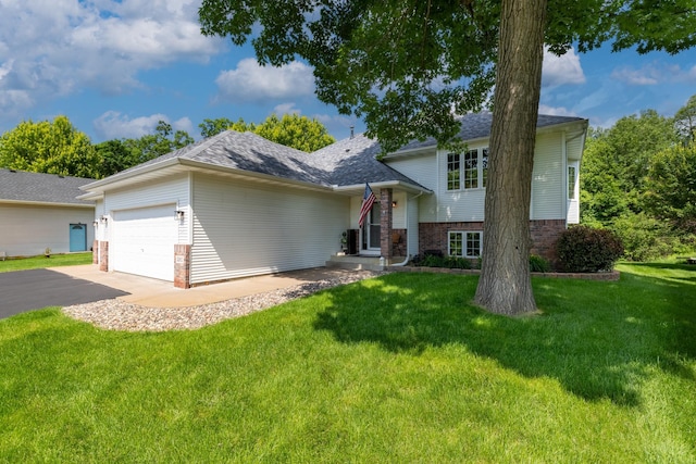 22615 Janero Ave N, Forest Lake, MN 55025 - tri-level home with brick siding, a front lawn, asphalt driveway, a garage, and roof with shingles