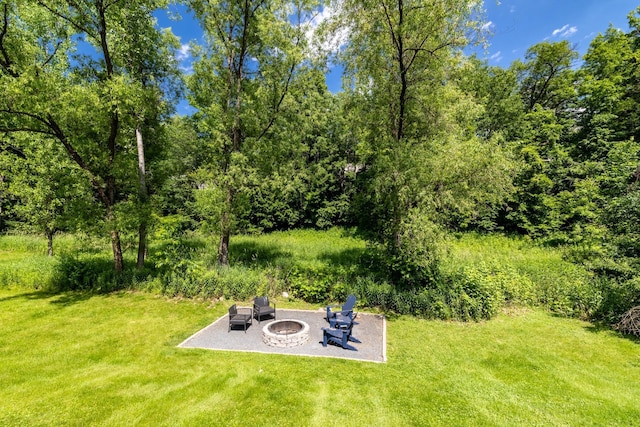 22615 Janero Ave N, Forest Lake, MN 55025 - view of green lawn with an outdoor fire pit and a patio area