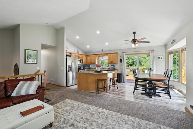 22615 Janero Ave N, Forest Lake, MN 55025 - living room featuring recessed lighting, ceiling fan, light wood finished floors, and high vaulted ceiling
