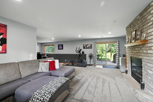 22615 Janero Ave N, Forest Lake, MN 55025 - living area with a fireplace, recessed lighting, plenty of natural light, and carpet flooring
