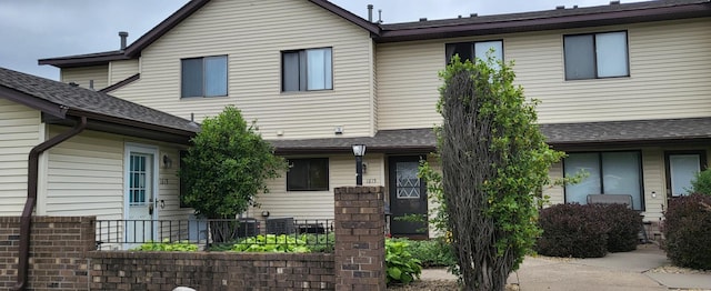 1615 Helmo Ave N, Oakdale, MN 55128 - view of front of property with roof with shingles