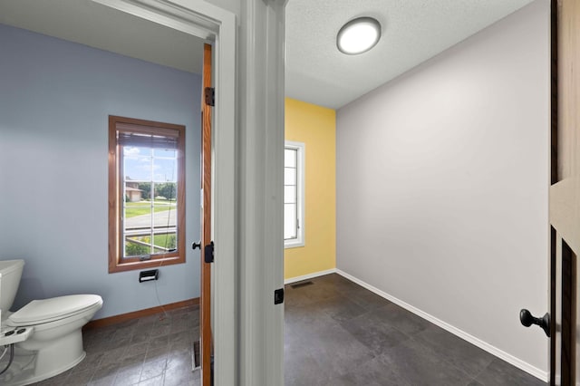 4802 102nd Trl N, Brooklyn Park, MN 55443 - bathroom featuring toilet and baseboards