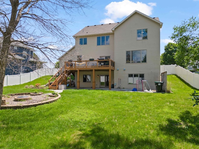 4802 102nd Trl N, Brooklyn Park, MN 55443 - back of property featuring a fire pit, stairs, a wooden deck, and a fenced backyard