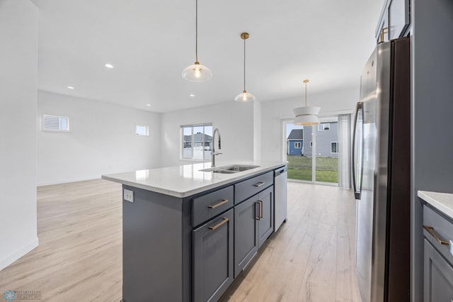 7326 28th St S, Fargo, ND 58104 - kitchen with stainless steel appliances, light wood-style flooring, gray cabinetry, plenty of natural light, and recessed lighting