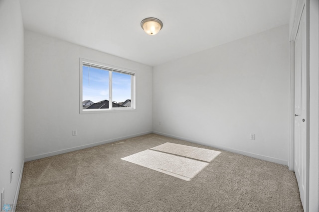 7326 28th St S, Fargo, ND 58104 - carpeted spare room featuring baseboards