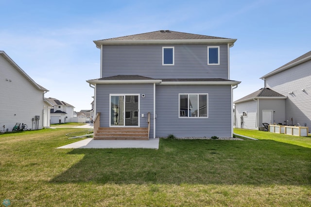 7326 28th St S, Fargo, ND 58104 - back of property featuring entry steps and a yard