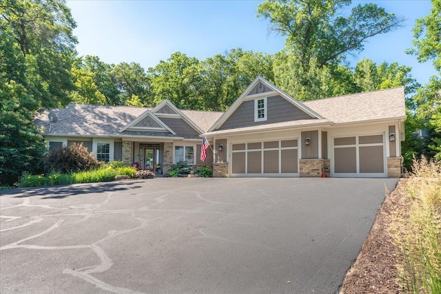 483 Meadow Ridge Ln, Troy Twp, WI 54016 - craftsman-style home with driveway, a garage, and stone siding