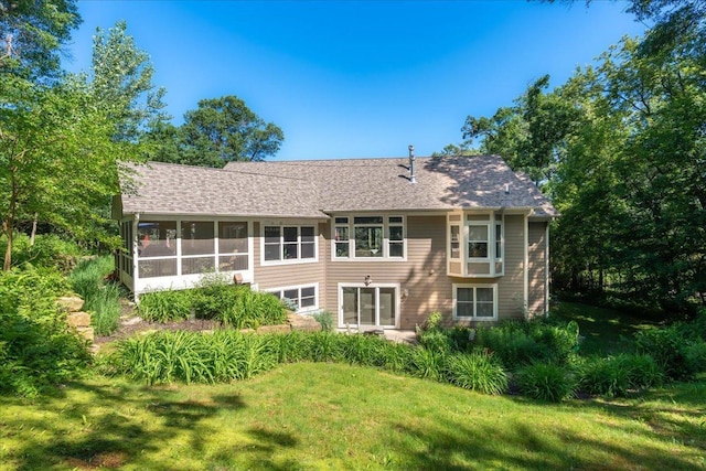 483 Meadow Ridge Ln, Troy Twp, WI 54016 - rear view of property featuring a yard, a sunroom, and roof with shingles